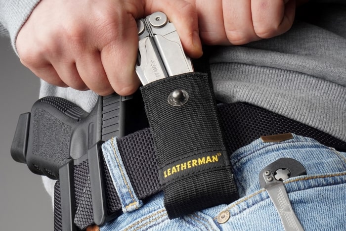EDC tactical belt with Glock pistol in holster
